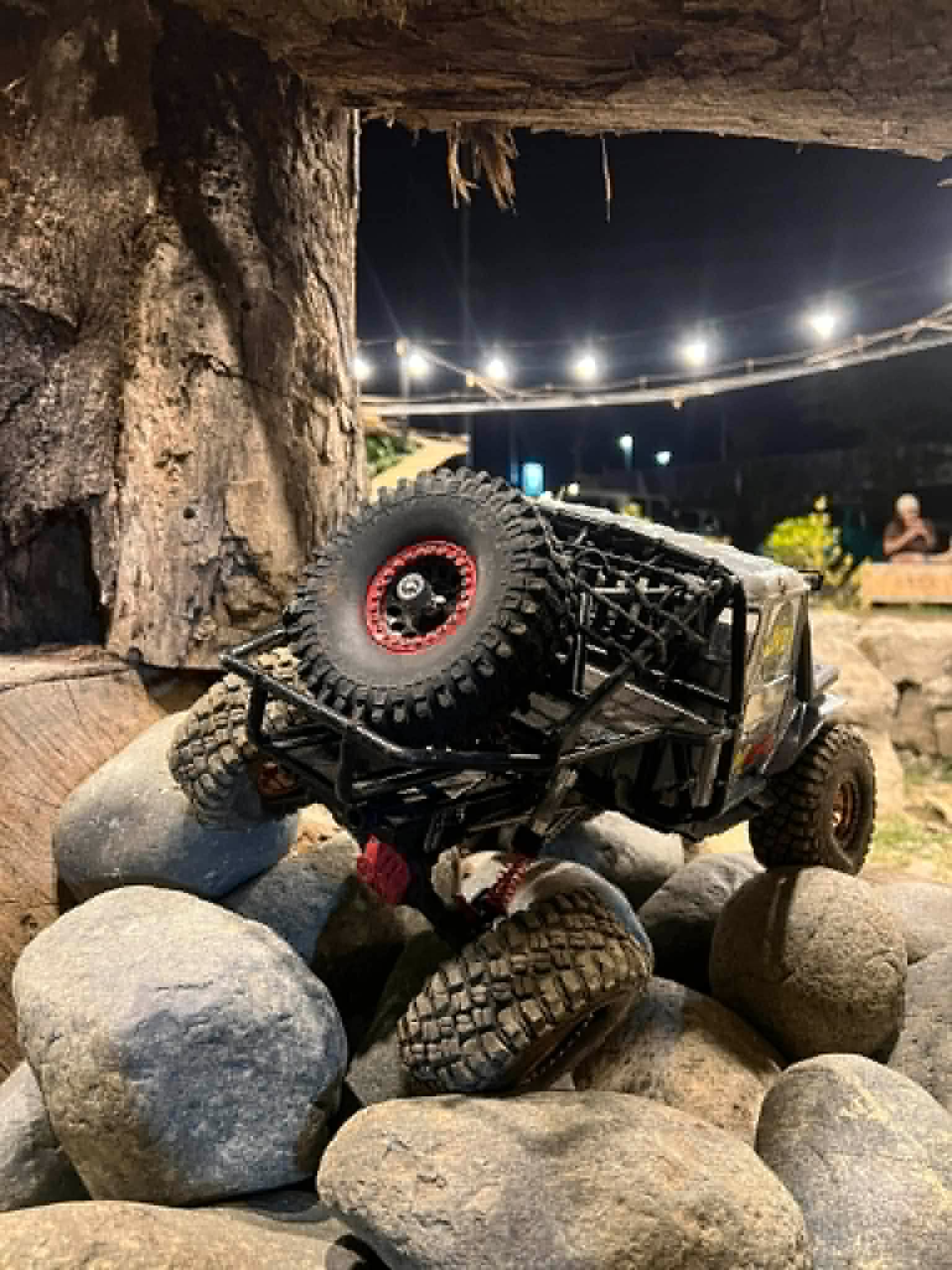 RC crawler on rock crawling section at Mudace RC Park at night