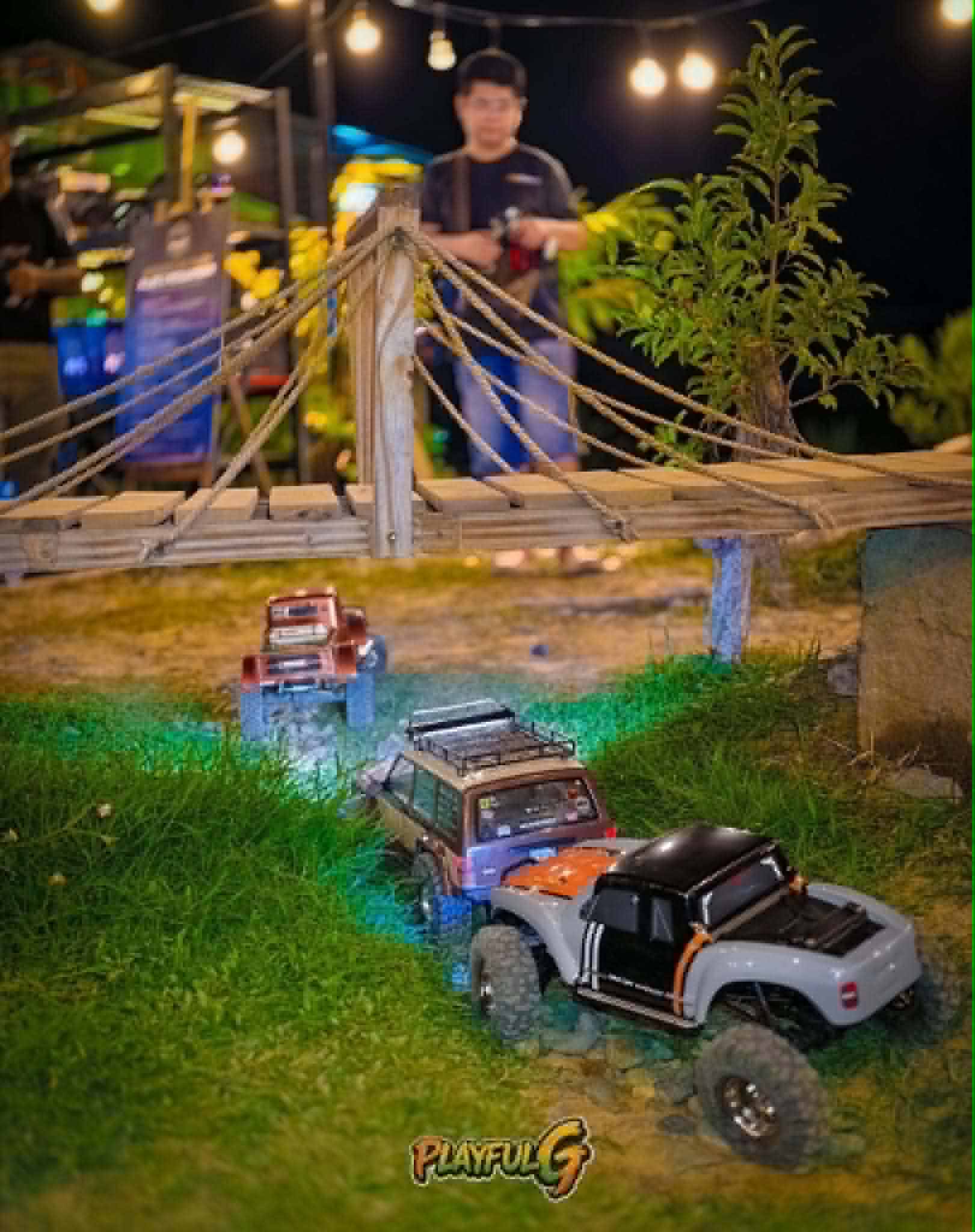 LED-lit RC crawlers at the rope suspension bridge obstacle Mudace RC Park